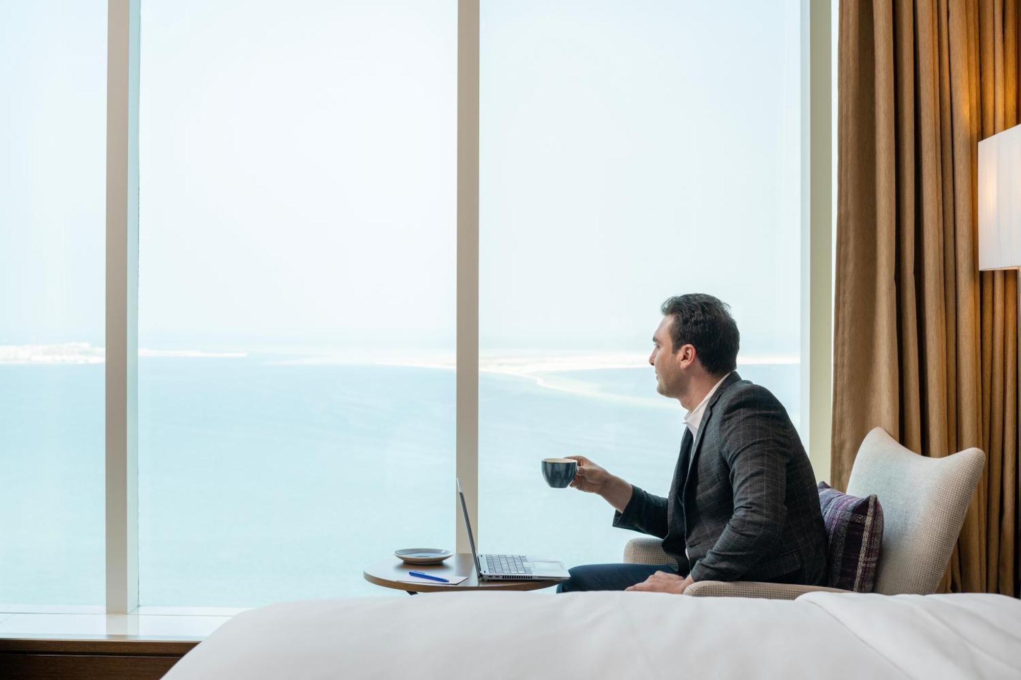 Delta Hotels By Marriott City Center Доха Экстерьер фото A guest enjoying the view from a room at the hotel